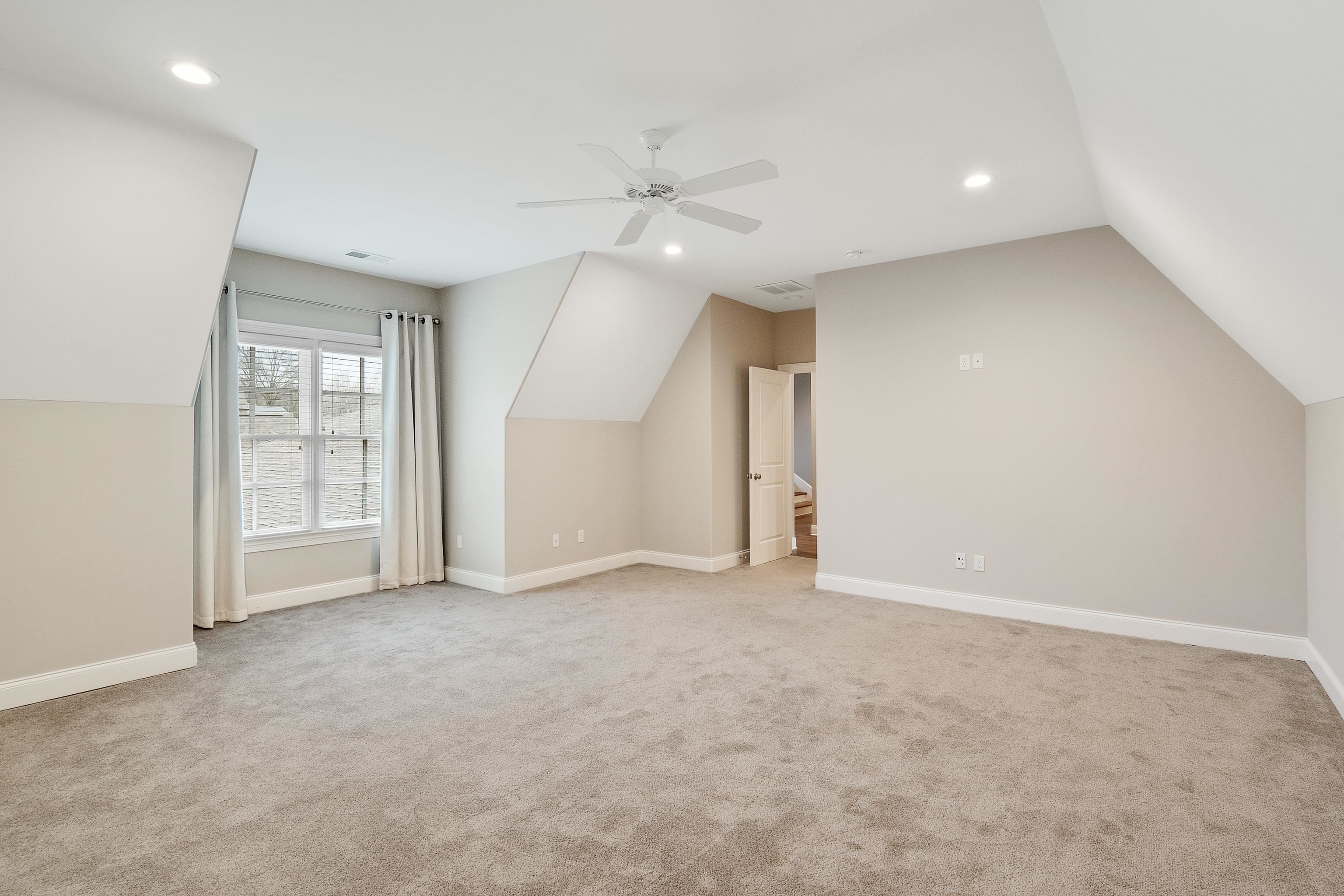 47 Addiegreen Cove Collierville, TN 38017 - Photo 17 of 34 an empty room with fan and windows