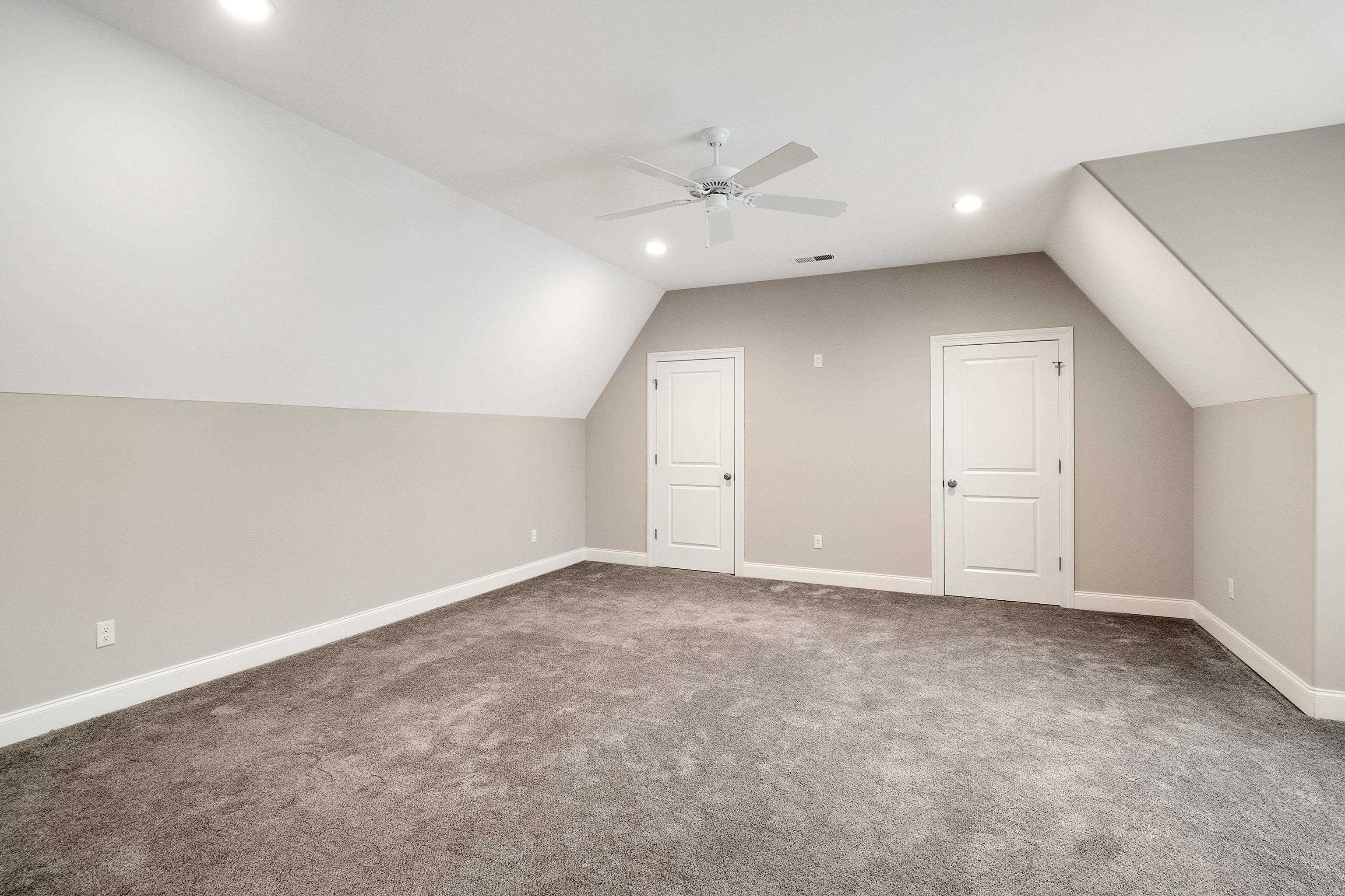 47 Addiegreen Cove Collierville, TN 38017 - Photo 18 of 34 an empty room with a ceiling fan and window