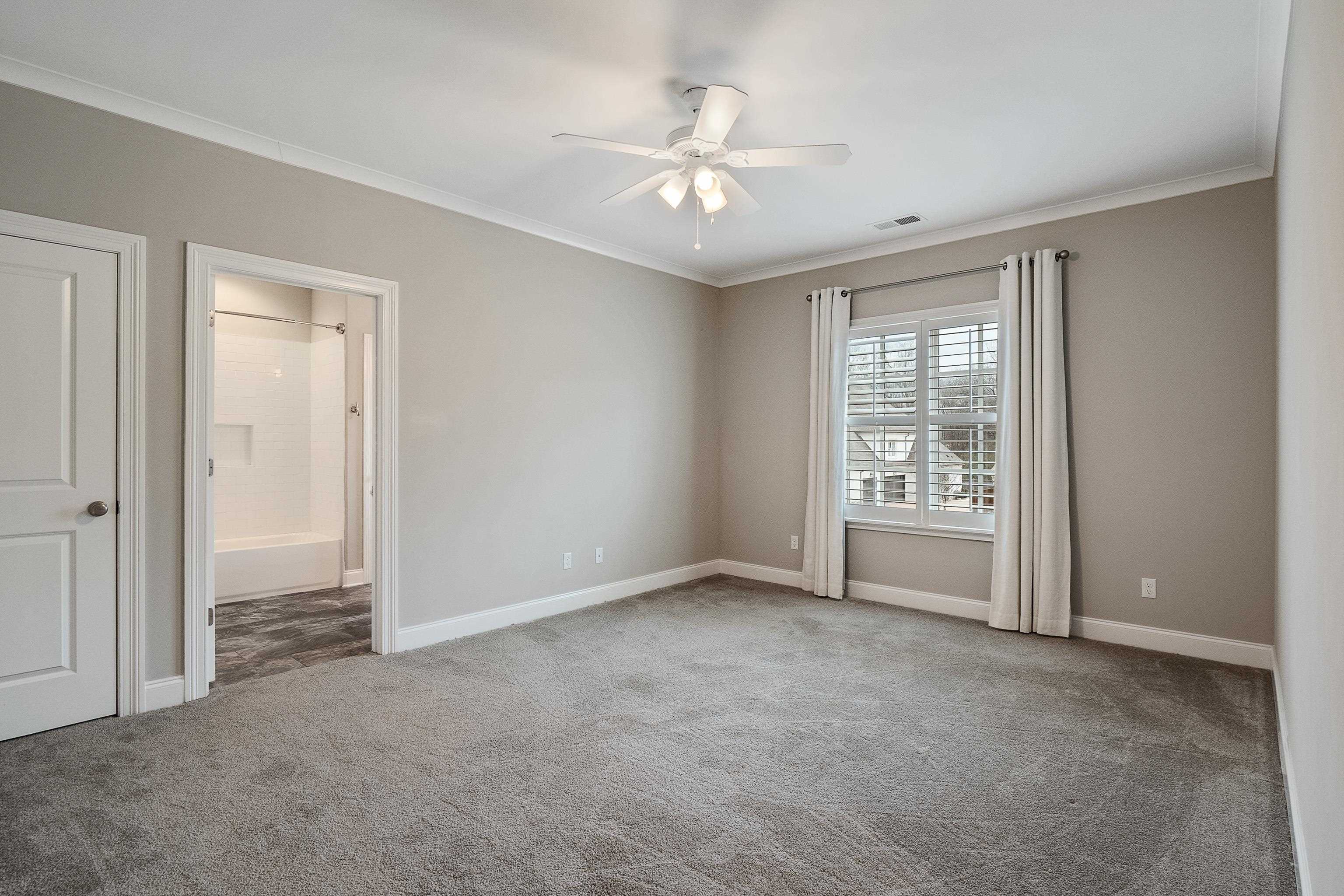 47 Addiegreen Cove Collierville, TN 38017 - Photo 21 of 34 an empty room with windows and closet