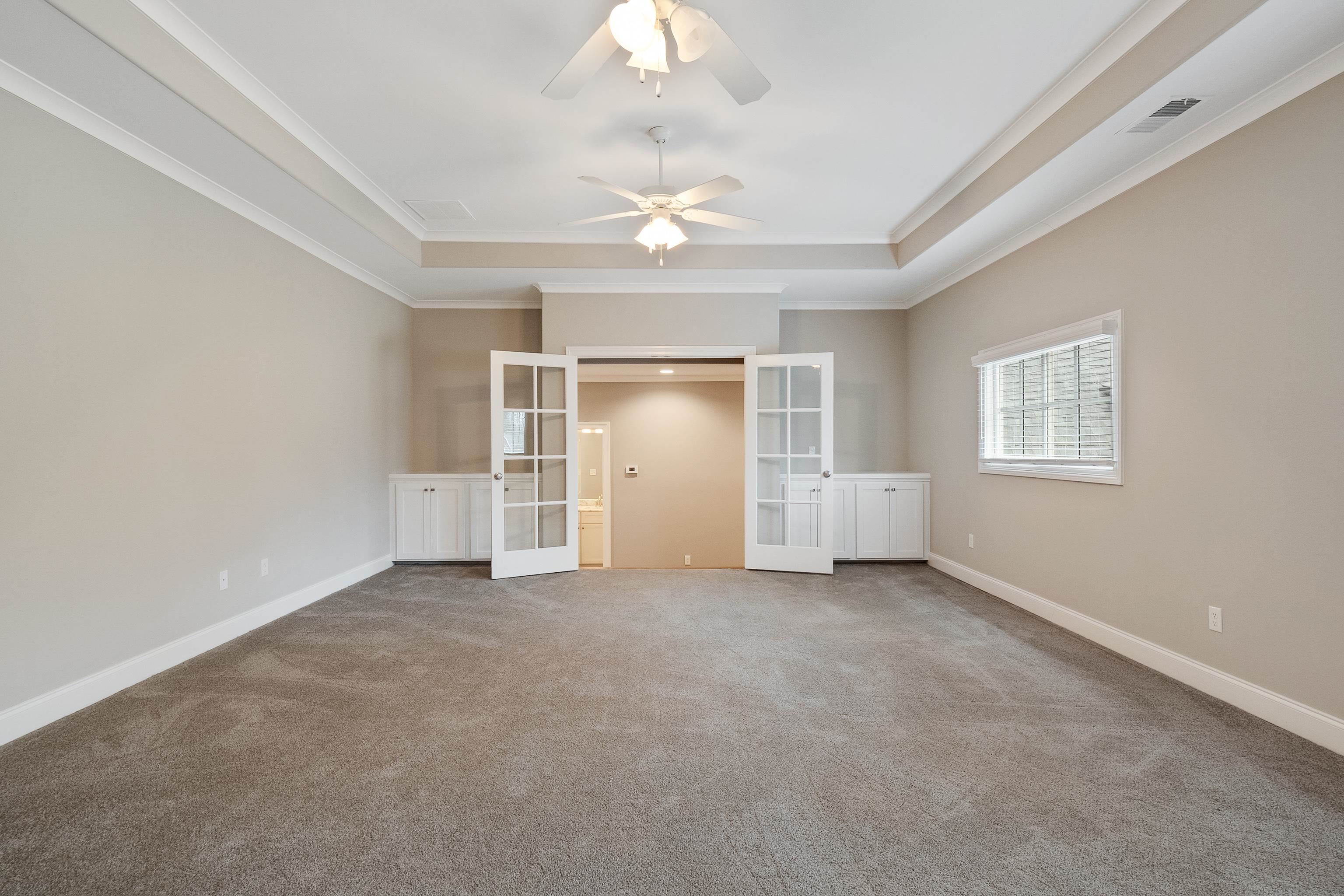 47 Addiegreen Cove Collierville, TN 38017 - Photo 27 of 34 a view of empty room with a ceiling fan and window