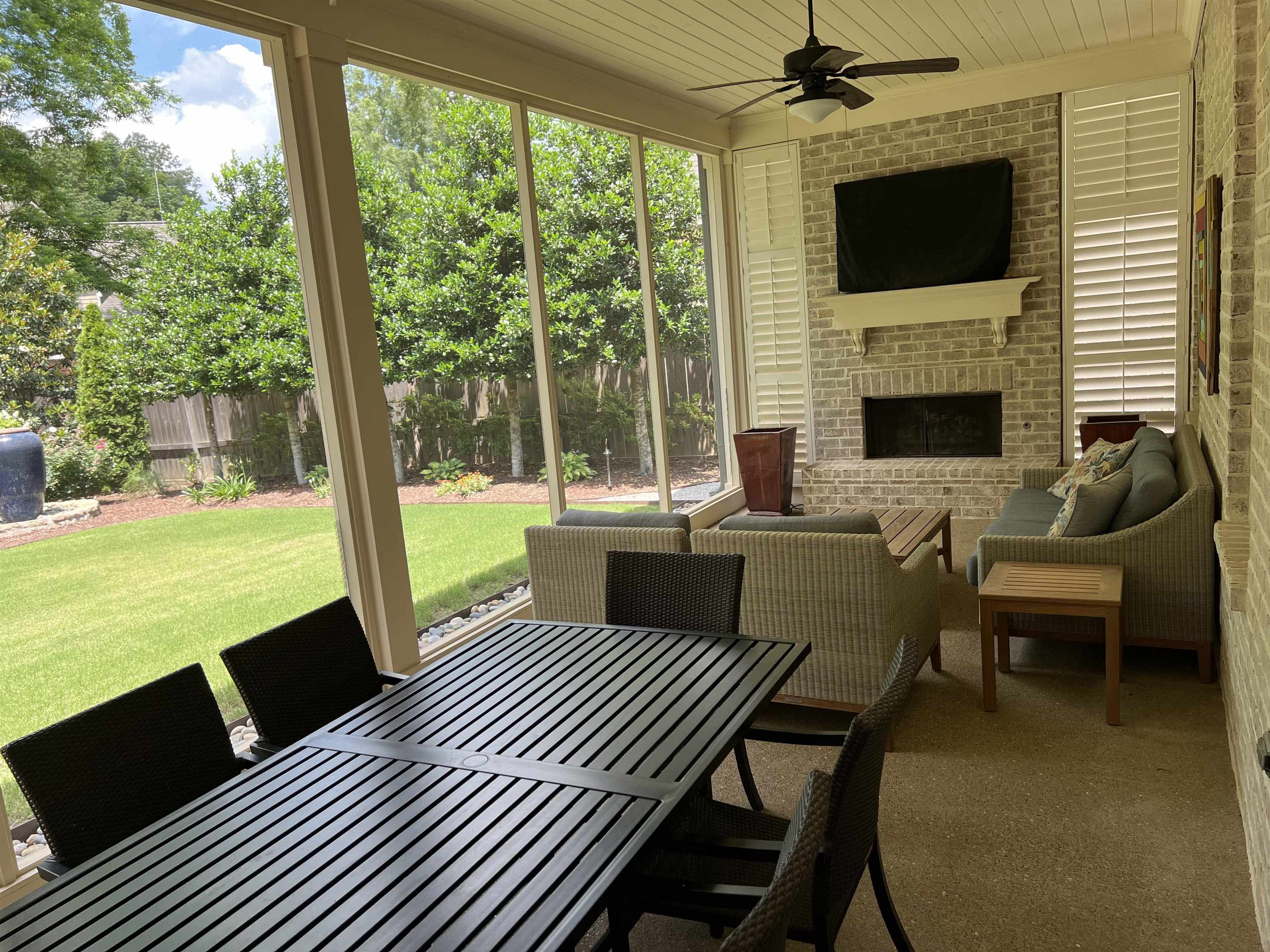 47 Addiegreen Cove Collierville, TN 38017 - Photo 28 of 34 a view of a patio with lawn chairs floor to ceiling window with yard