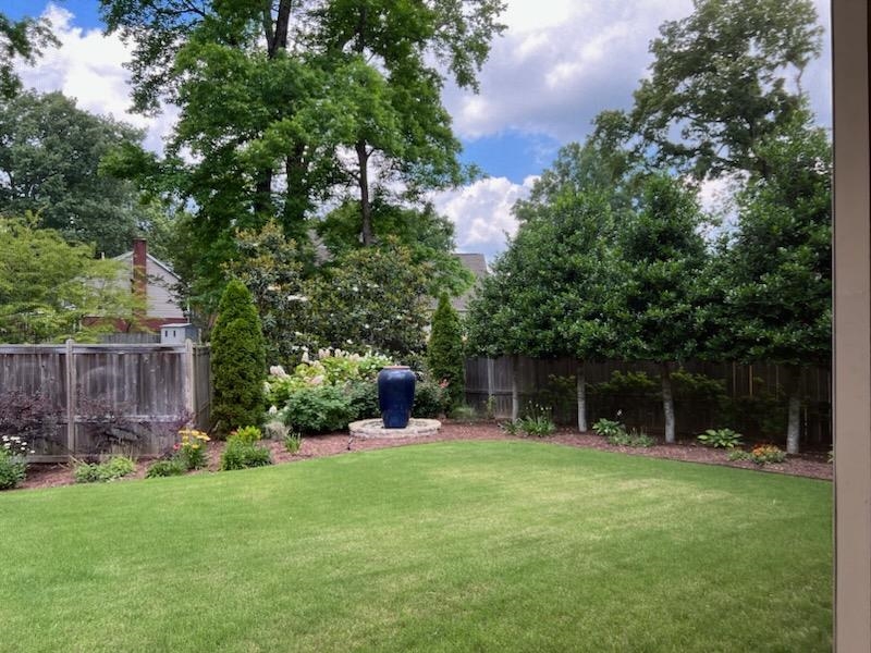 47 Addiegreen Cove Collierville, TN 38017 - Photo 30 of 34 a view of a backyard with a garden