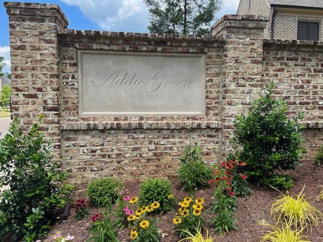 47 Addiegreen Cove Collierville, TN 38017 - Photo 31 of 34 a view of a stone house with a yard