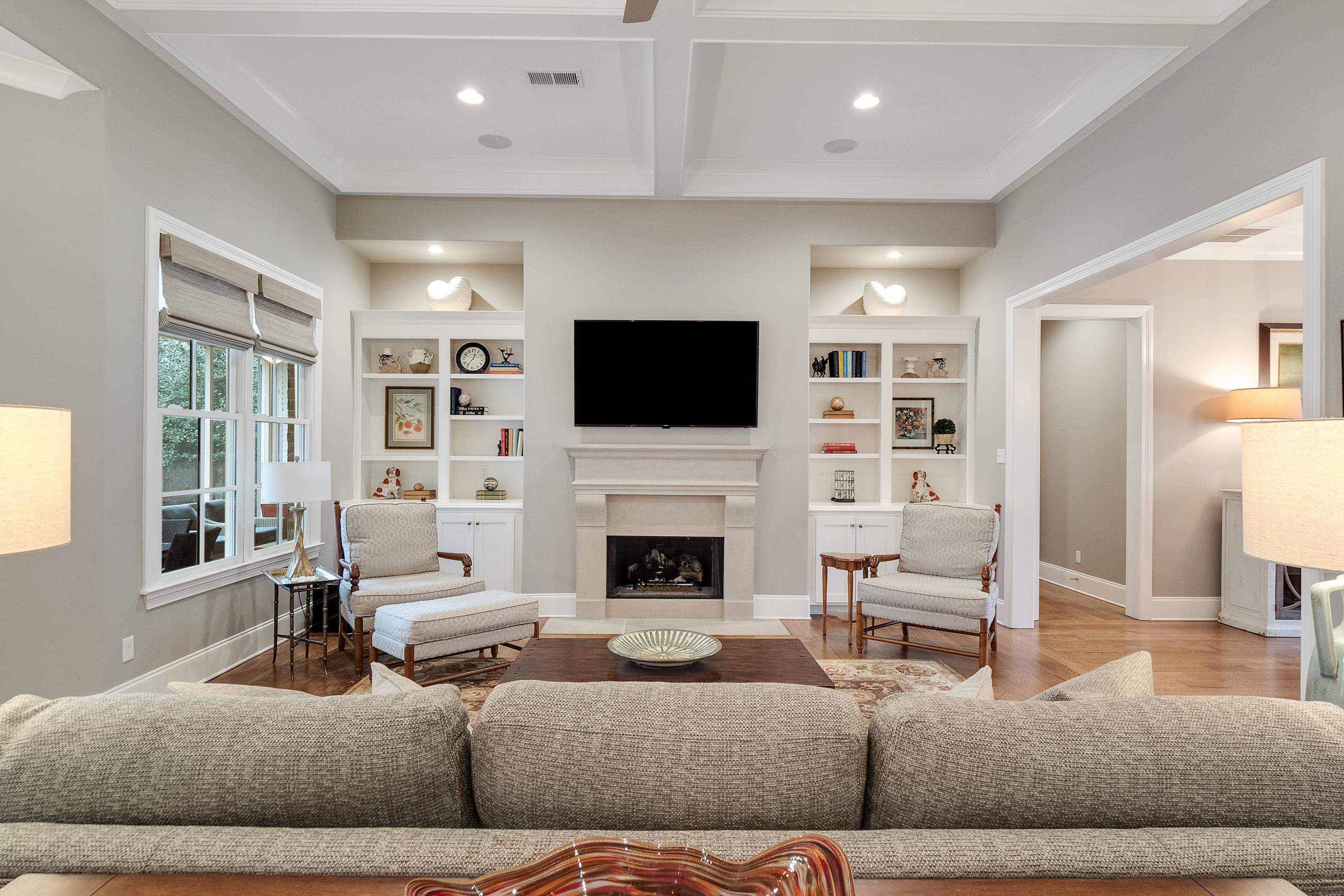 47 Addiegreen Cove Collierville, TN 38017 - Photo 5 of 34 a living room with furniture a fireplace and a flat screen tv