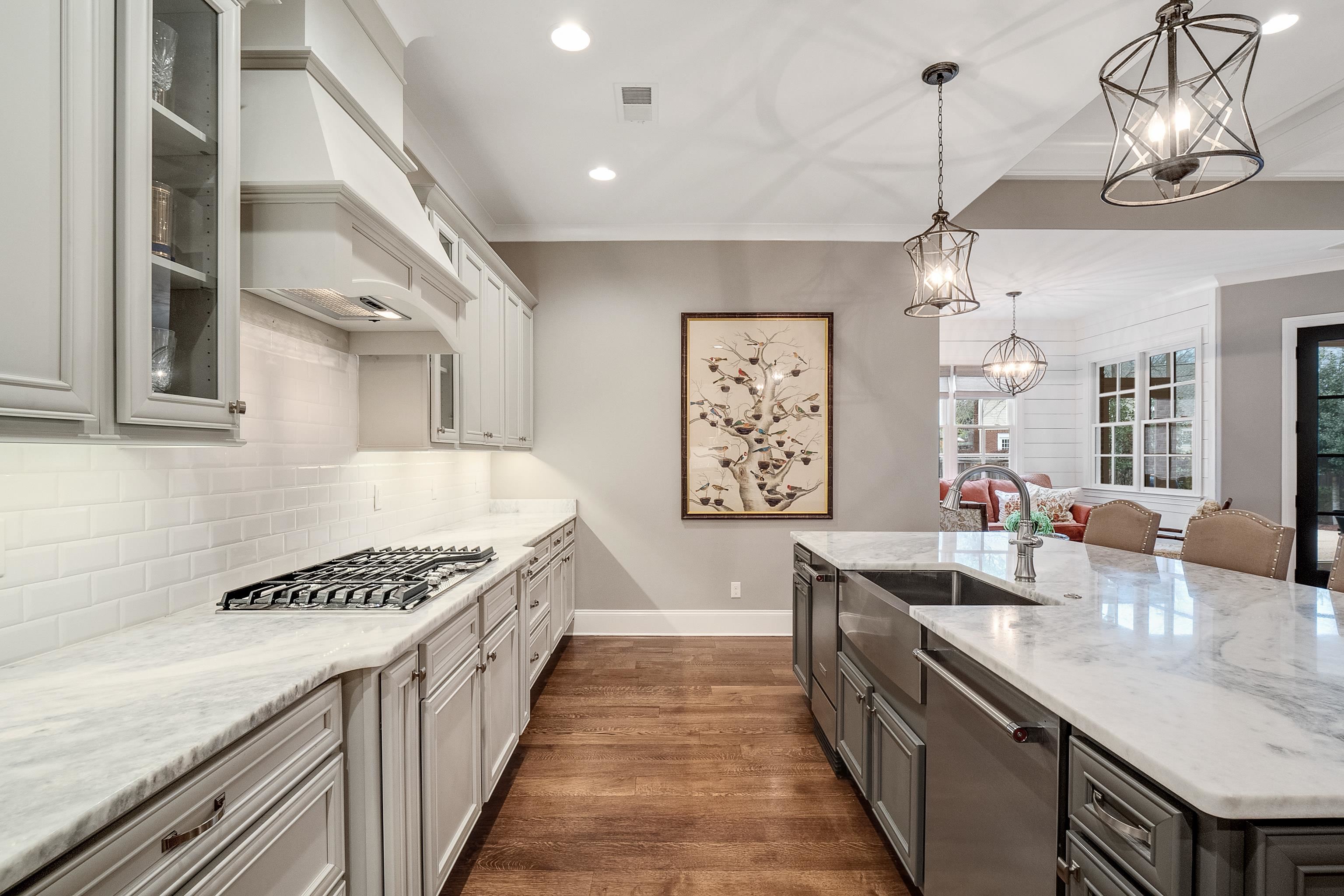 47 Addiegreen Cove Collierville, TN 38017 - Photo 10 of 34 a kitchen with stainless steel appliances kitchen island a refrigerator and cabinets