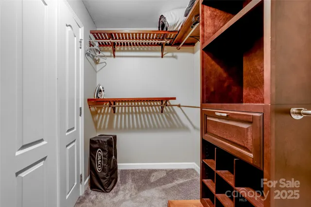 a bathroom with a granite countertop sink a mirror and a shower