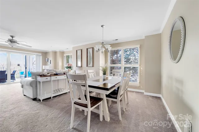 a view of a dining room with furniture and window