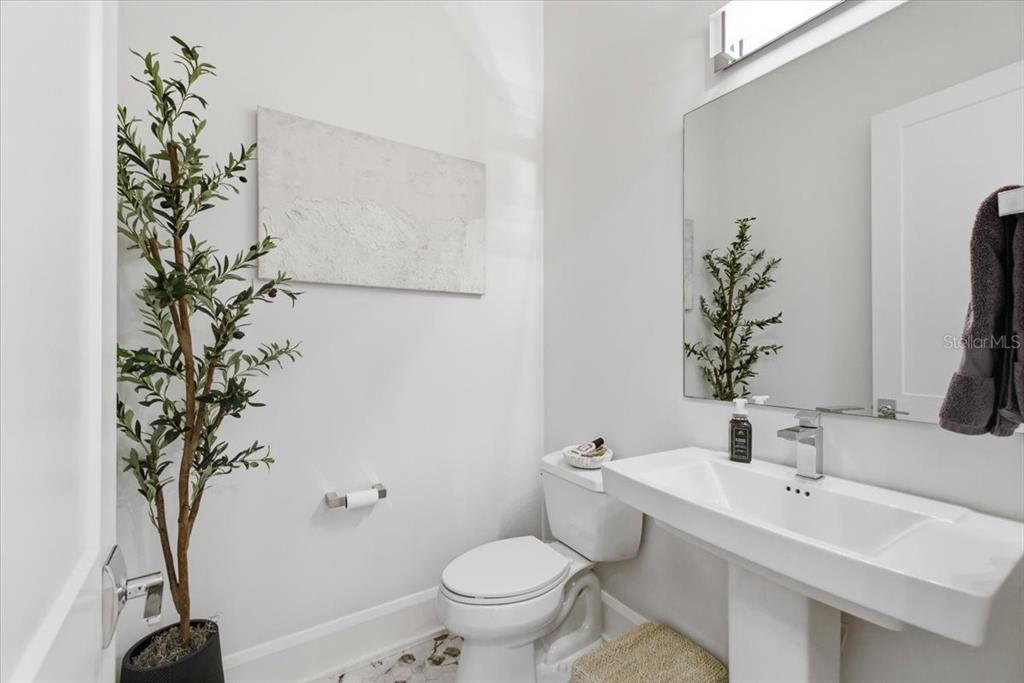 2829 Coastal Range Way Lutz, FL 33559 - Photo 30 of 64 a bathroom with a sink toilet and a mirror