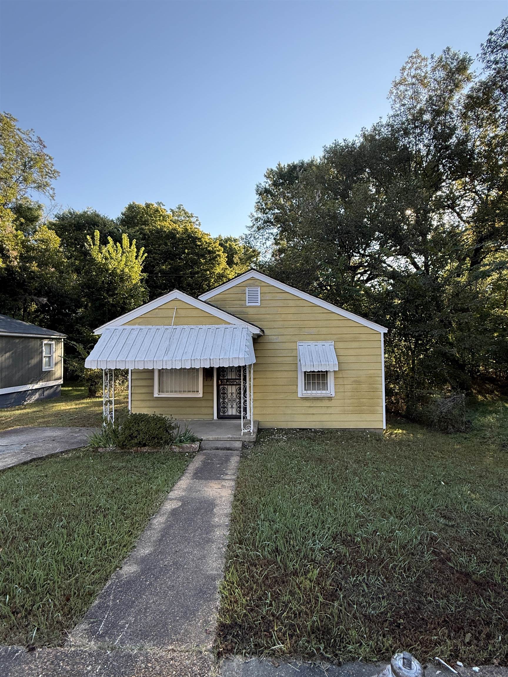 a backyard of a house with wooden fence