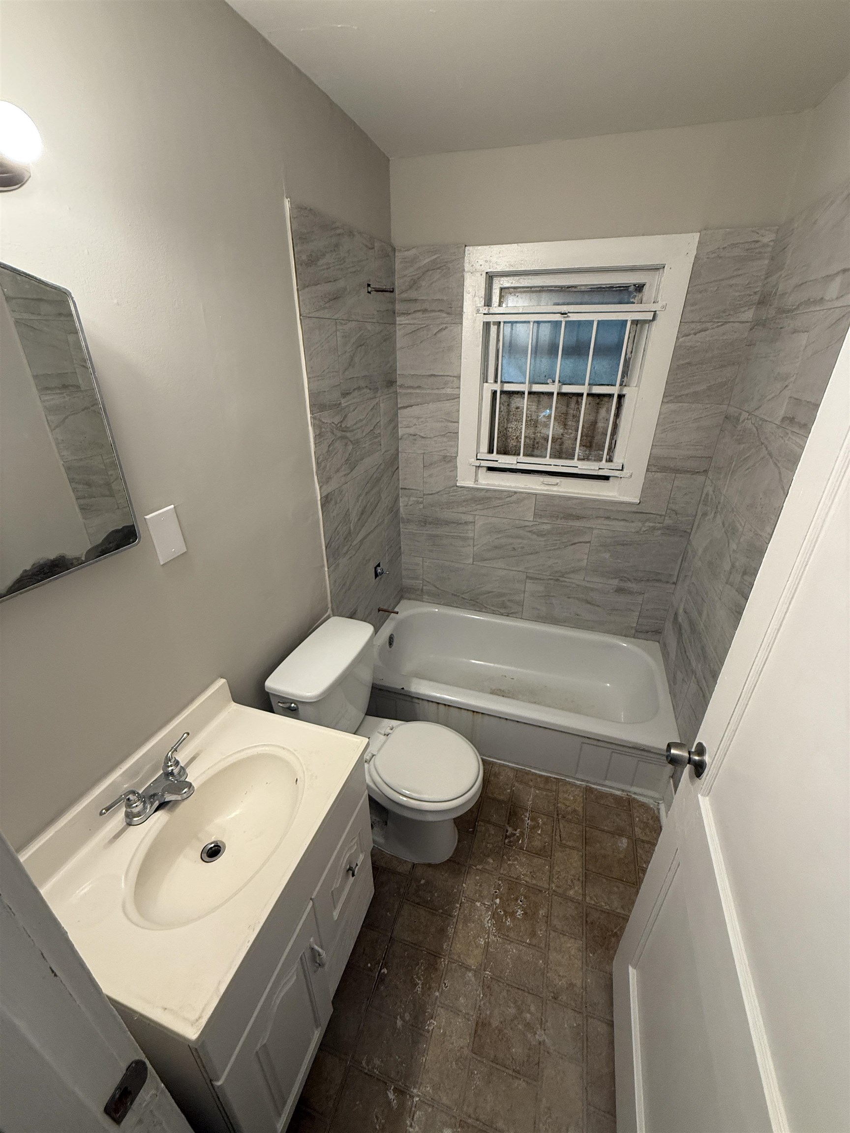 1540 Gabay Street Memphis, TN 38106 - Photo 9 of 10 a bathroom with a sink toilet and shower