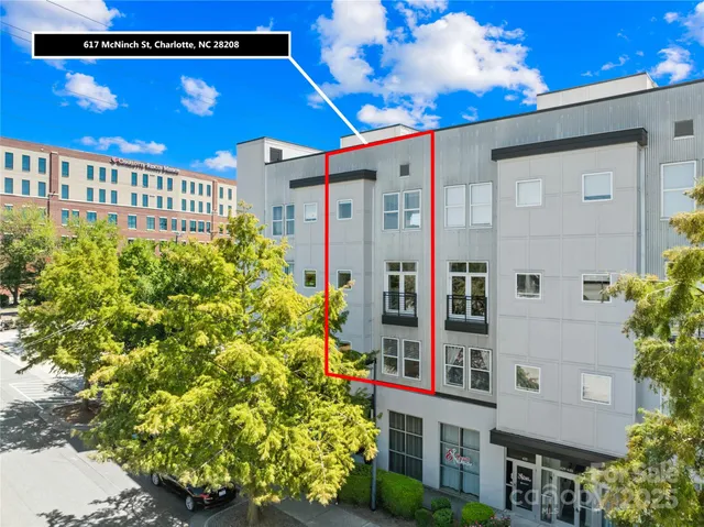 a view of a building with a flower garden