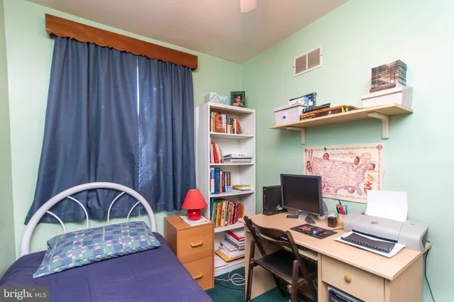 a workspace with furniture and bedroom