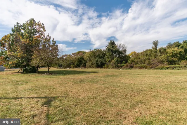 a view of a street with a building in the background