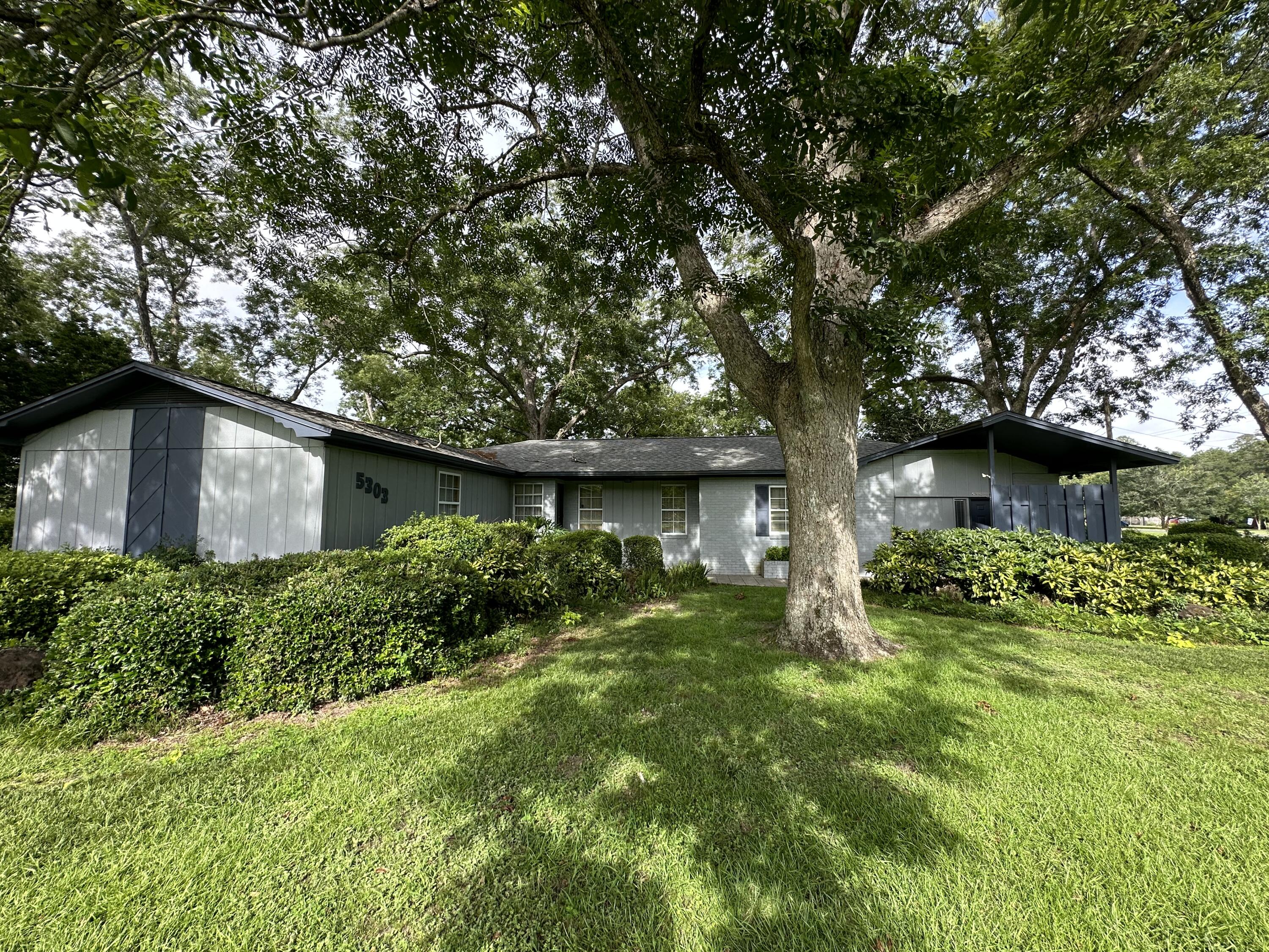 5303 Griffith Mill Road Baker, FL 32531 - Photo 1 of 58 a backyard of a house with lots of green space