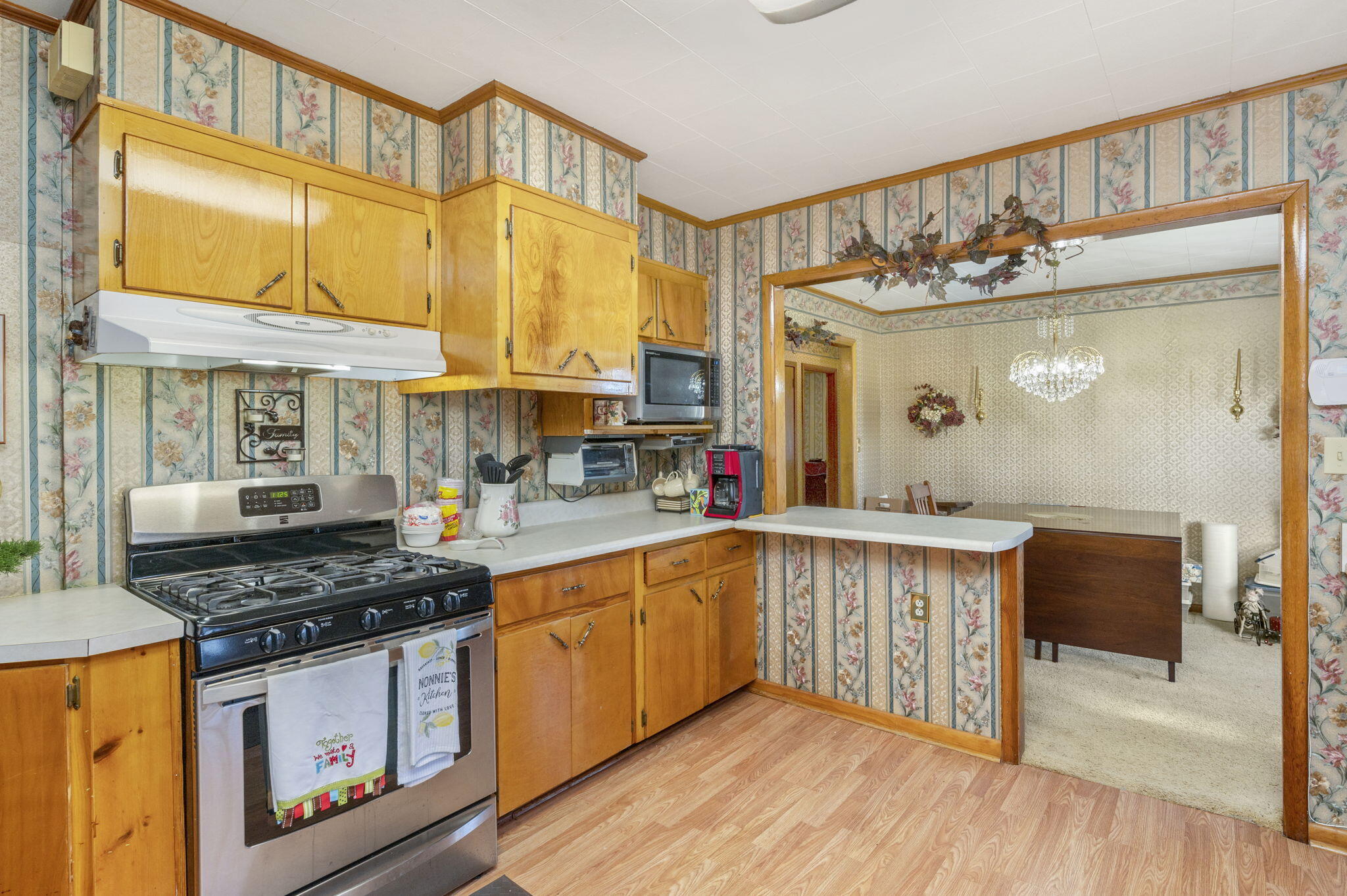 5303 Griffith Mill Road Baker, FL 32531 - Photo 13 of 58 a kitchen with stainless steel appliances granite countertop a stove and cabinets
