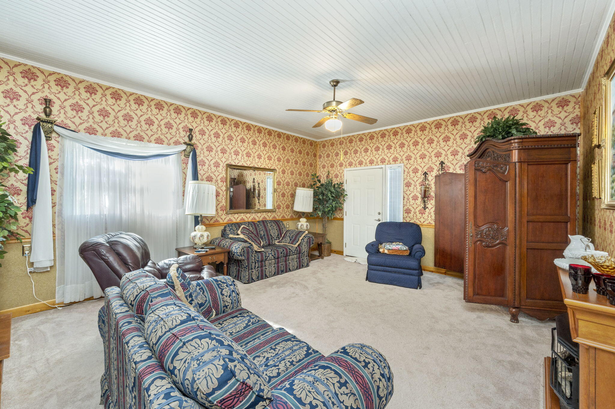 5303 Griffith Mill Road Baker, FL 32531 - Photo 15 of 58 a bedroom with furniture and a large mirror