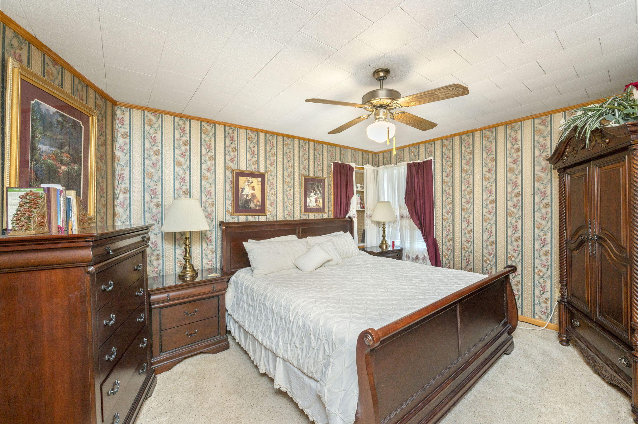 5303 Griffith Mill Road Baker, FL 32531 - Photo 23 of 58 a bedroom with a bed dresser and a window