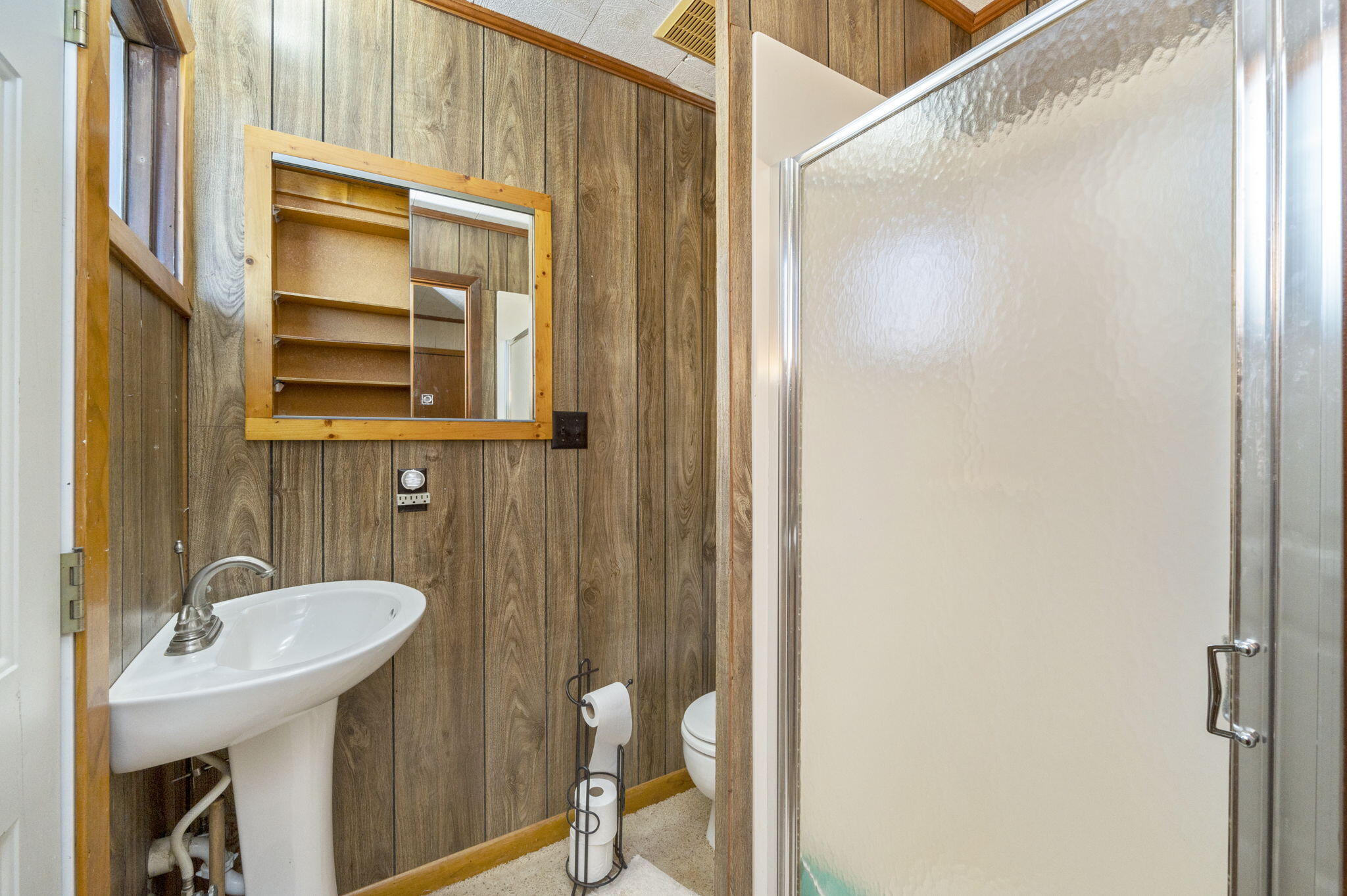 5303 Griffith Mill Road Baker, FL 32531 - Photo 24 of 58 a bathroom with a sink and a mirror