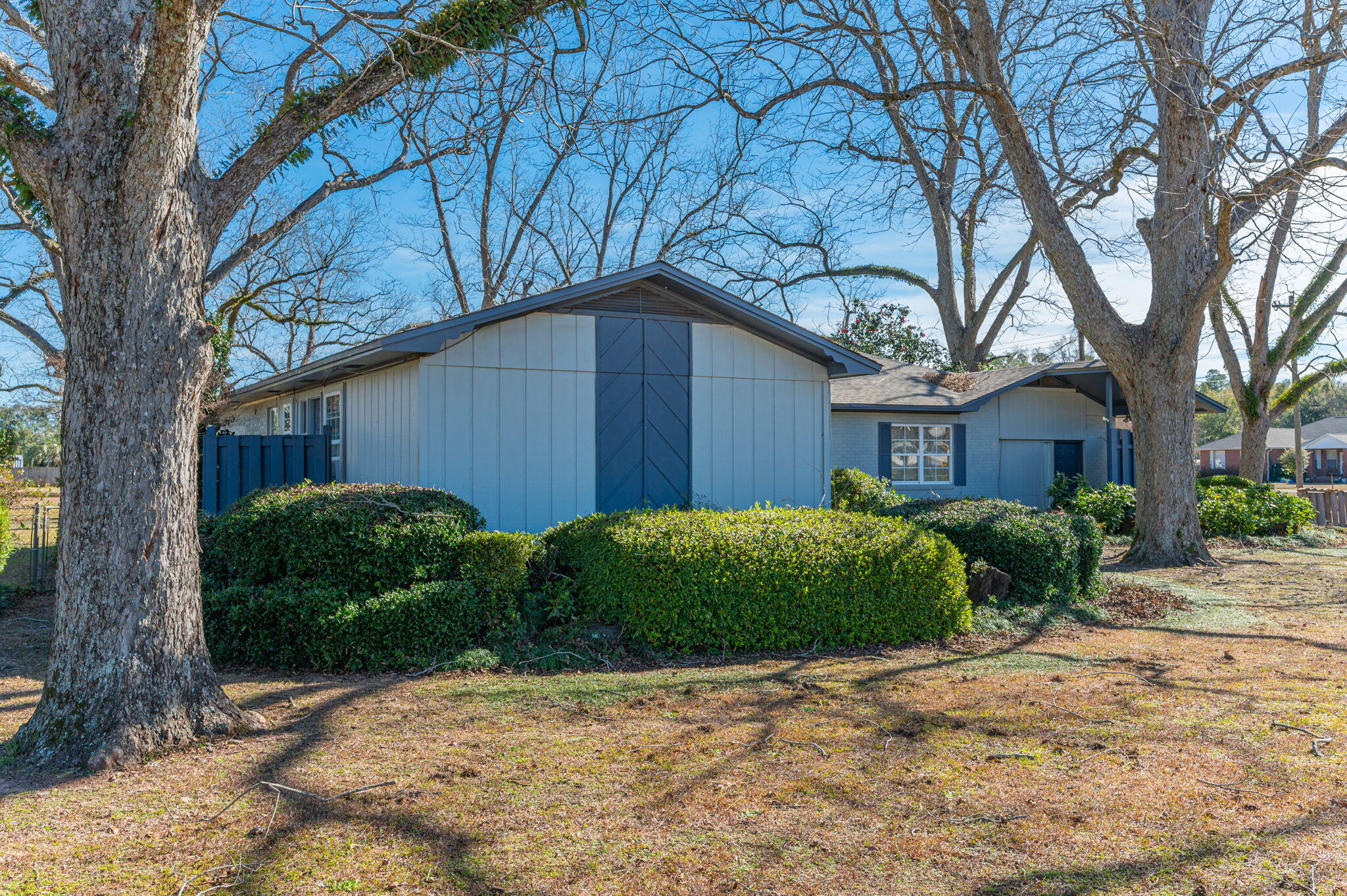 5303 Griffith Mill Road Baker, FL 32531 - Photo 26 of 58 a front view of a house with garden