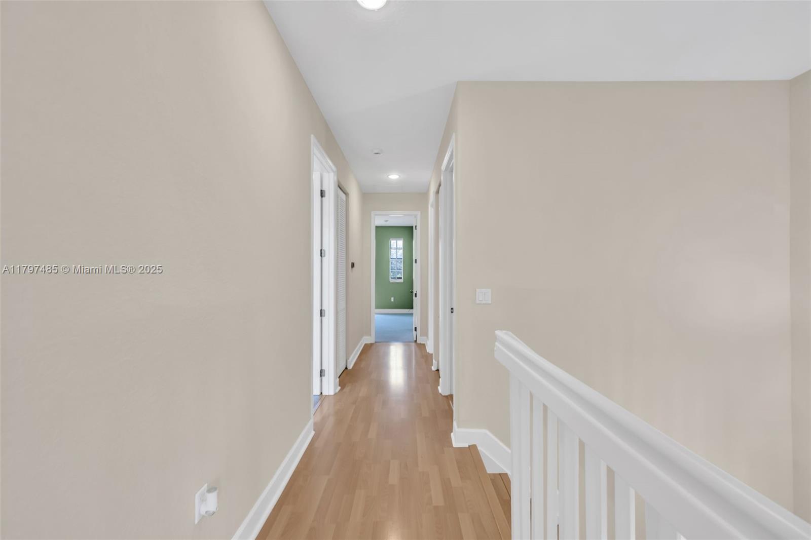 8706 Blaze Court Davie, FL 33328 - Photo 14 of 44 a view of a hallway with wooden floor