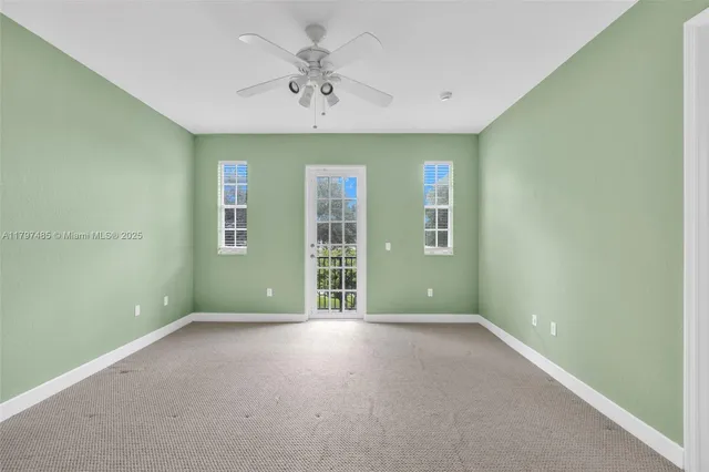 an empty room with a empty space and windows