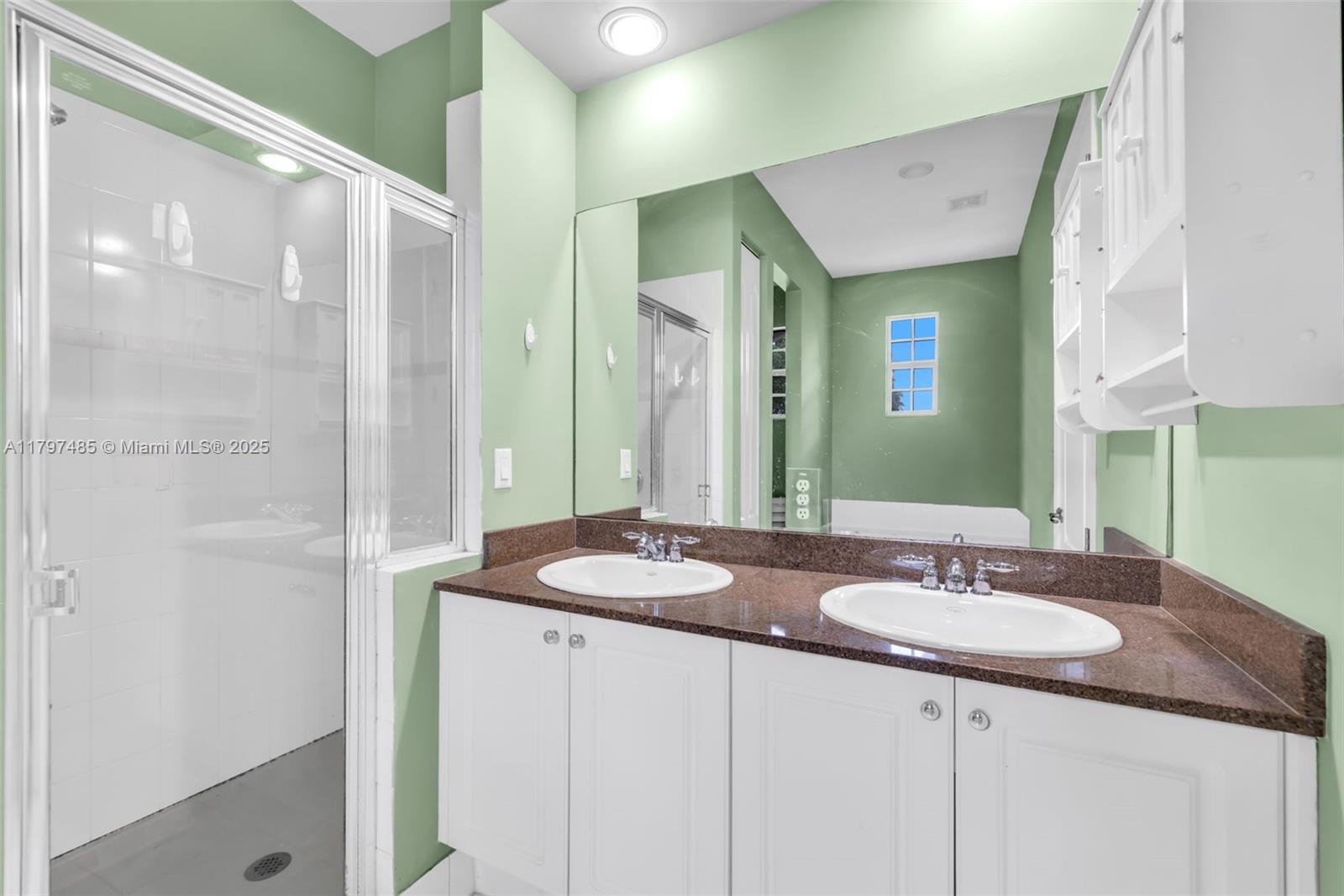 8706 Blaze Court Davie, FL 33328 - Photo 21 of 44 a bathroom with a sink and a mirror