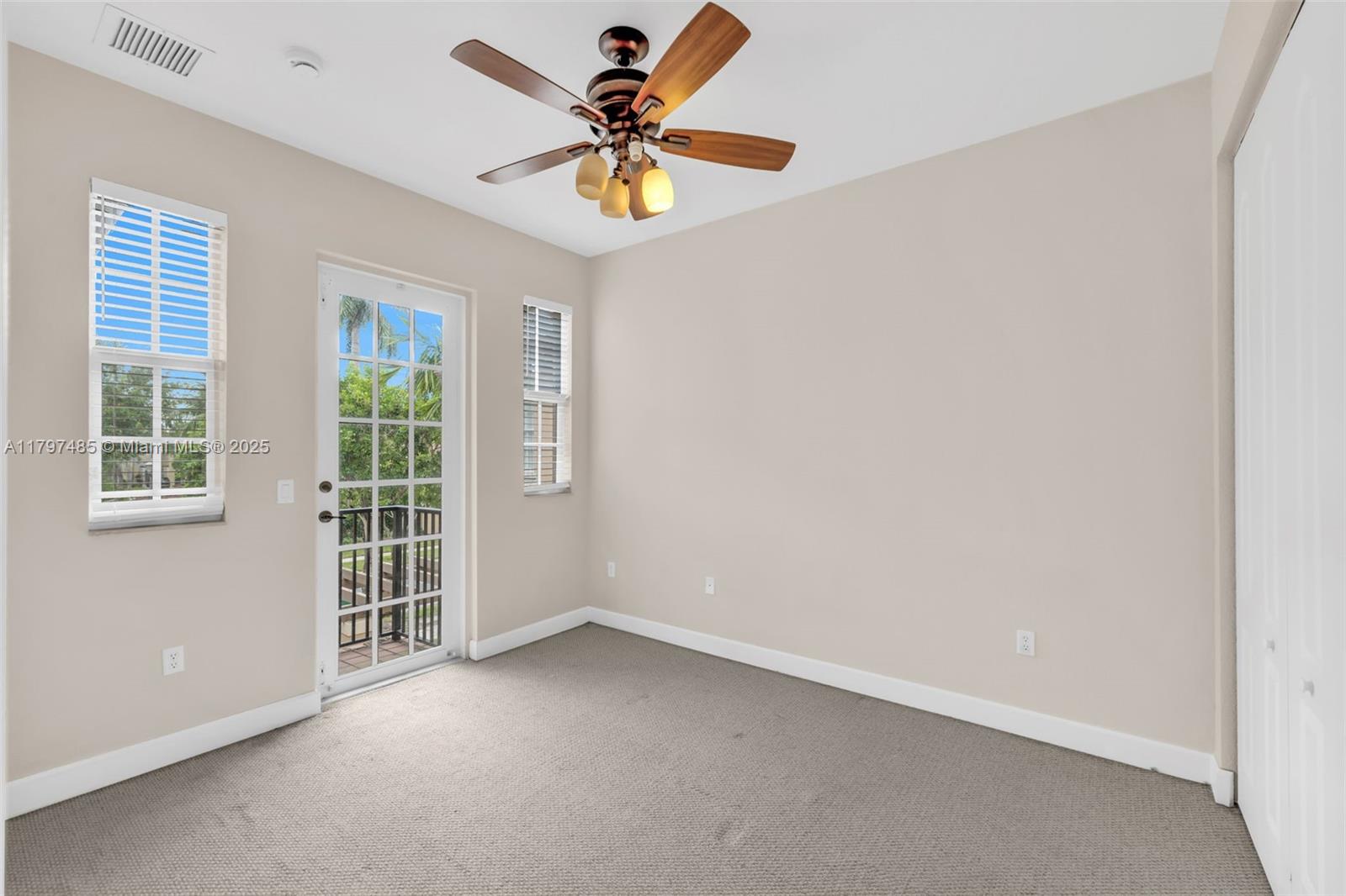 8706 Blaze Court Davie, FL 33328 - Photo 23 of 44 an empty room with a window and a fan