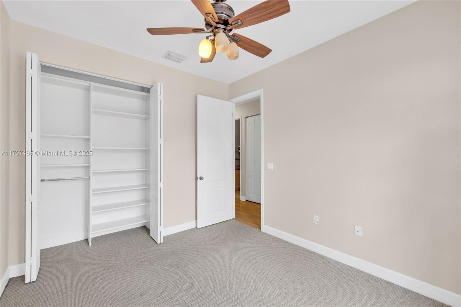 8706 Blaze Court Davie, FL 33328 - Photo 25 of 44 a view of an empty room with a window