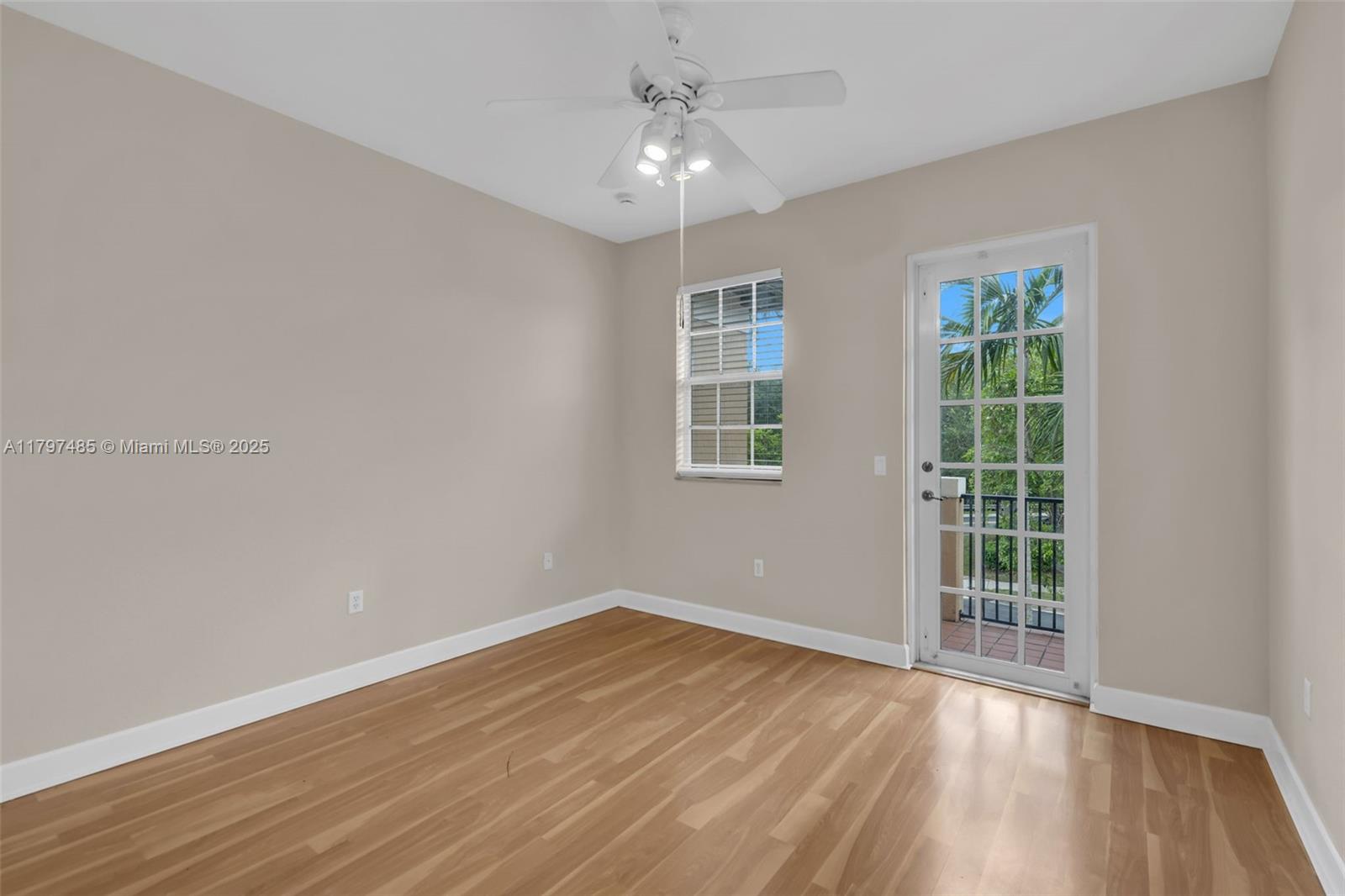 8706 Blaze Court Davie, FL 33328 - Photo 27 of 44 wooden floor in an empty room with a window