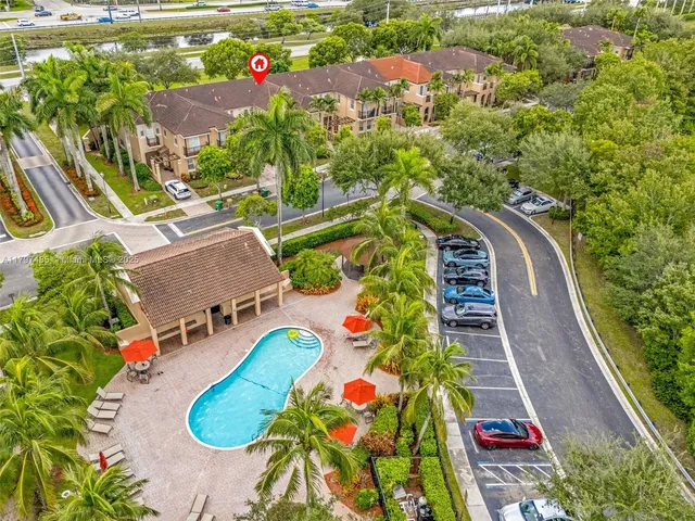 an aerial view of house with yard