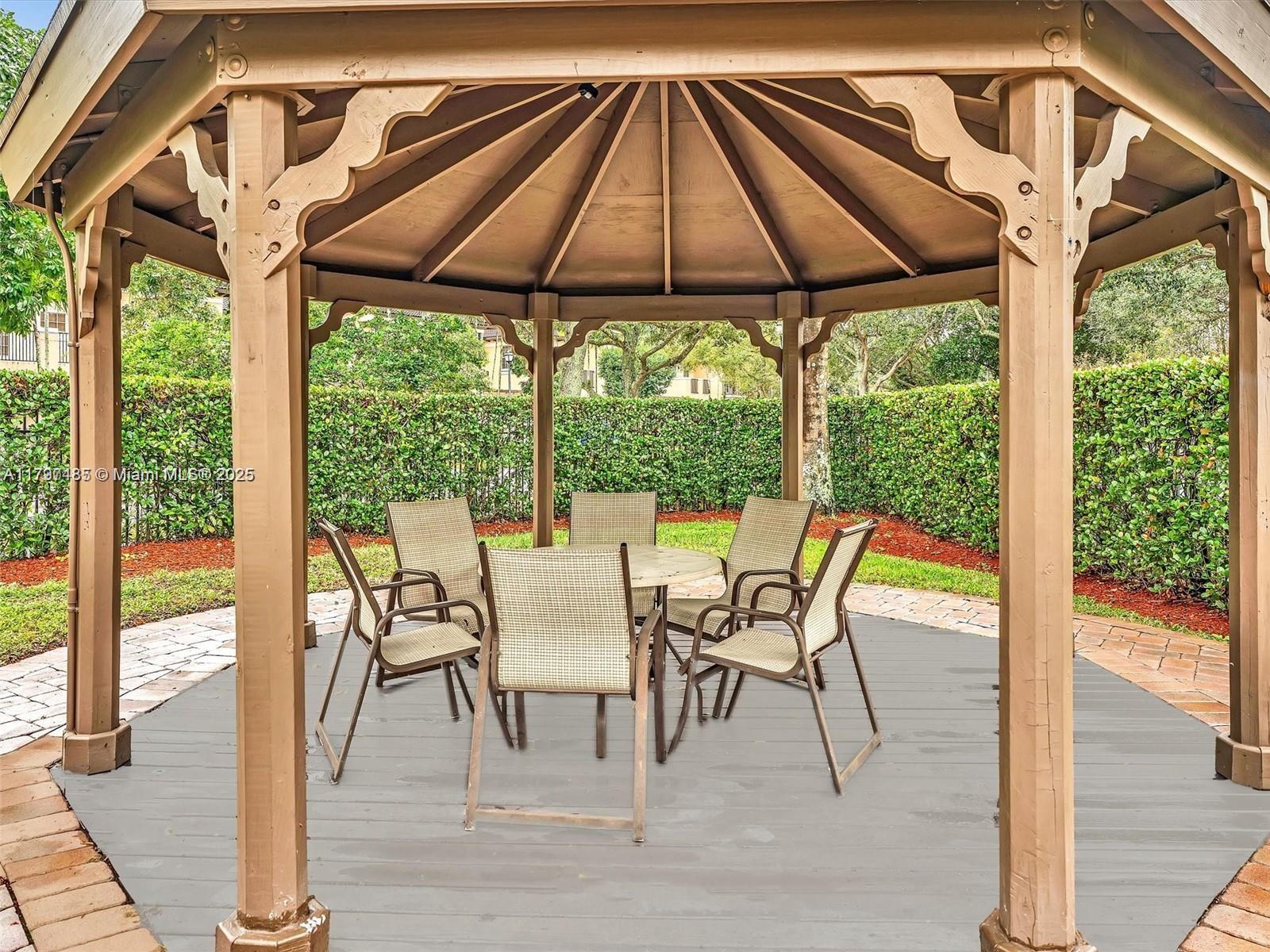 8706 Blaze Court Davie, FL 33328 - Photo 37 of 44 a lawn chairs and table in the patio