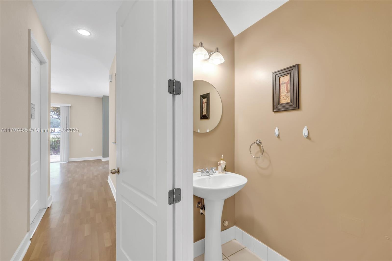 8706 Blaze Court Davie, FL 33328 - Photo 6 of 44 a bathroom with a sink and a mirror