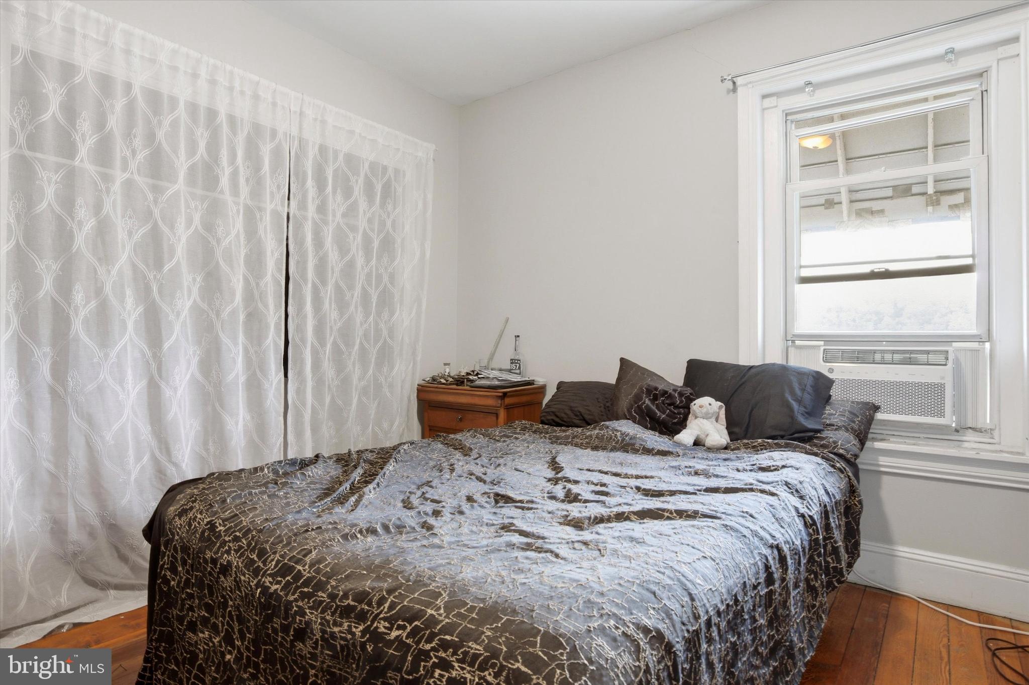 343 Spring Mill Avenue Conshohocken, PA 19428 - Photo 11 of 24 a bedroom with a bed and a window