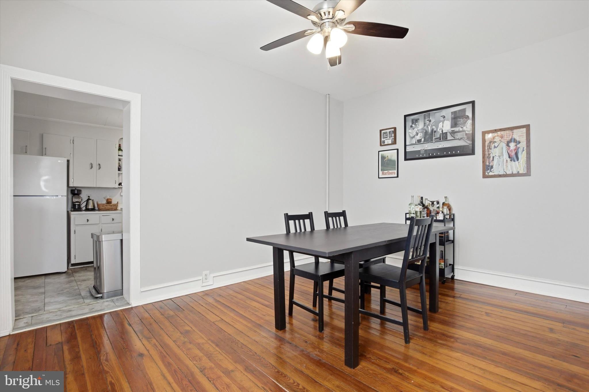 343 Spring Mill Avenue Conshohocken, PA 19428 - Photo 6 of 24 a view of a dining room with furniture and wooden floor