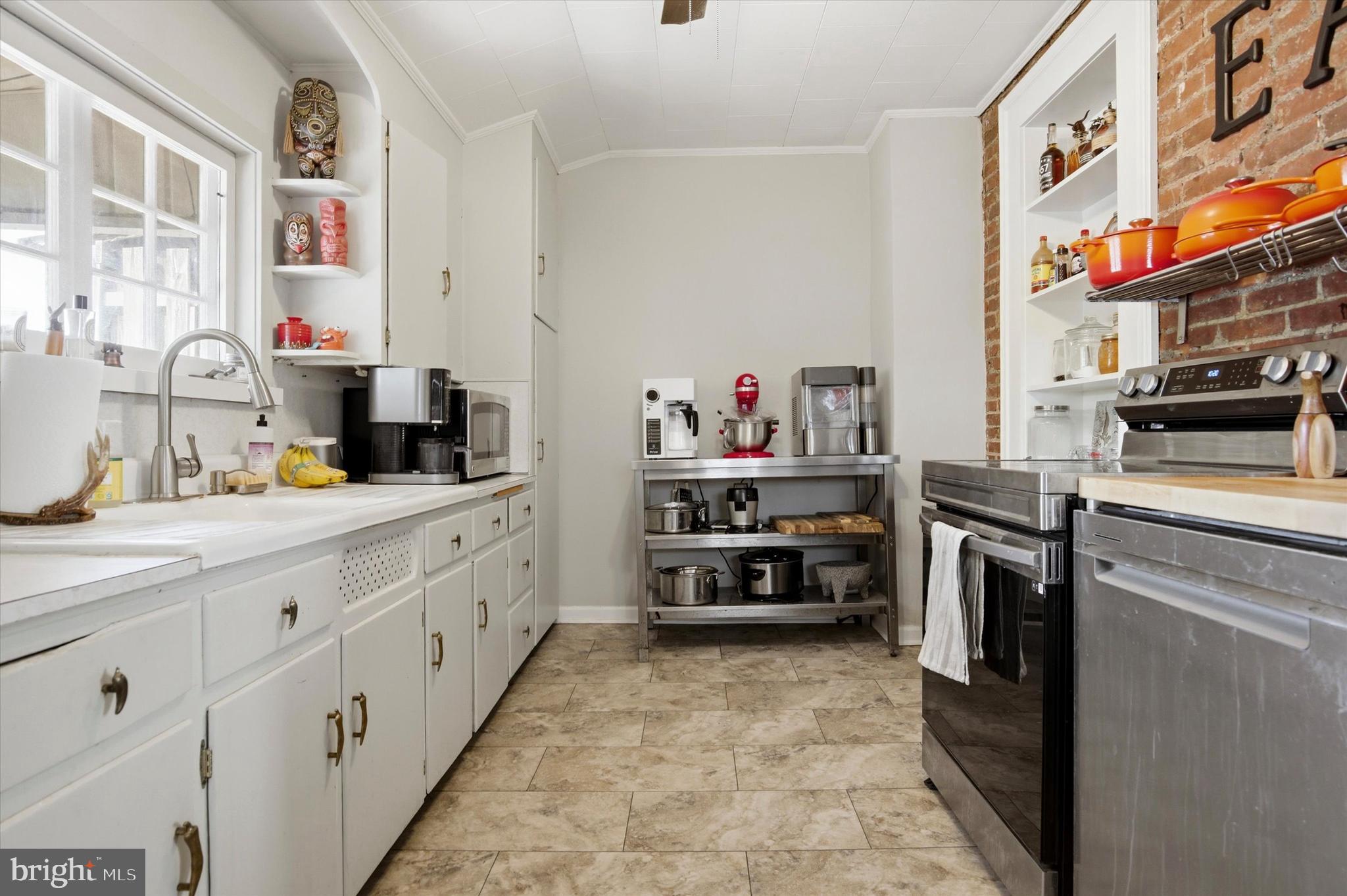 343 Spring Mill Avenue Conshohocken, PA 19428 - Photo 9 of 24 a kitchen with stainless steel appliances and cabinets