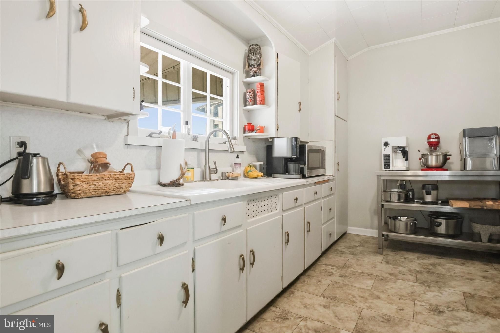 343 Spring Mill Avenue Conshohocken, PA 19428 - Photo 10 of 24 a kitchen with cabinets and window