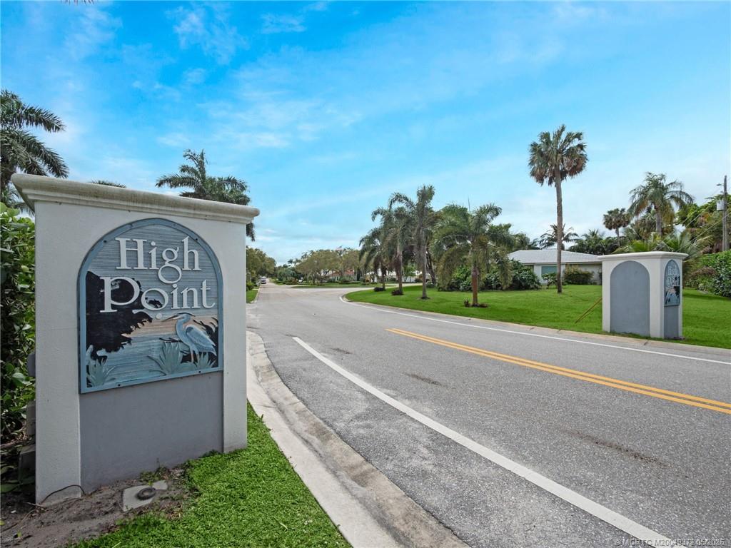 6 West High Point Road Stuart, FL 34996 - Photo 46 of 54 a view of a street with a sign on the wall
