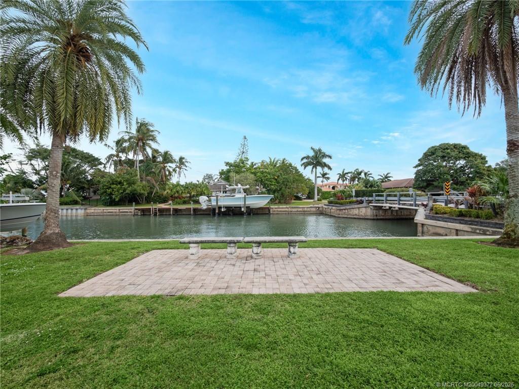 6 West High Point Road Stuart, FL 34996 - Photo 49 of 54 a lake view with a garden
