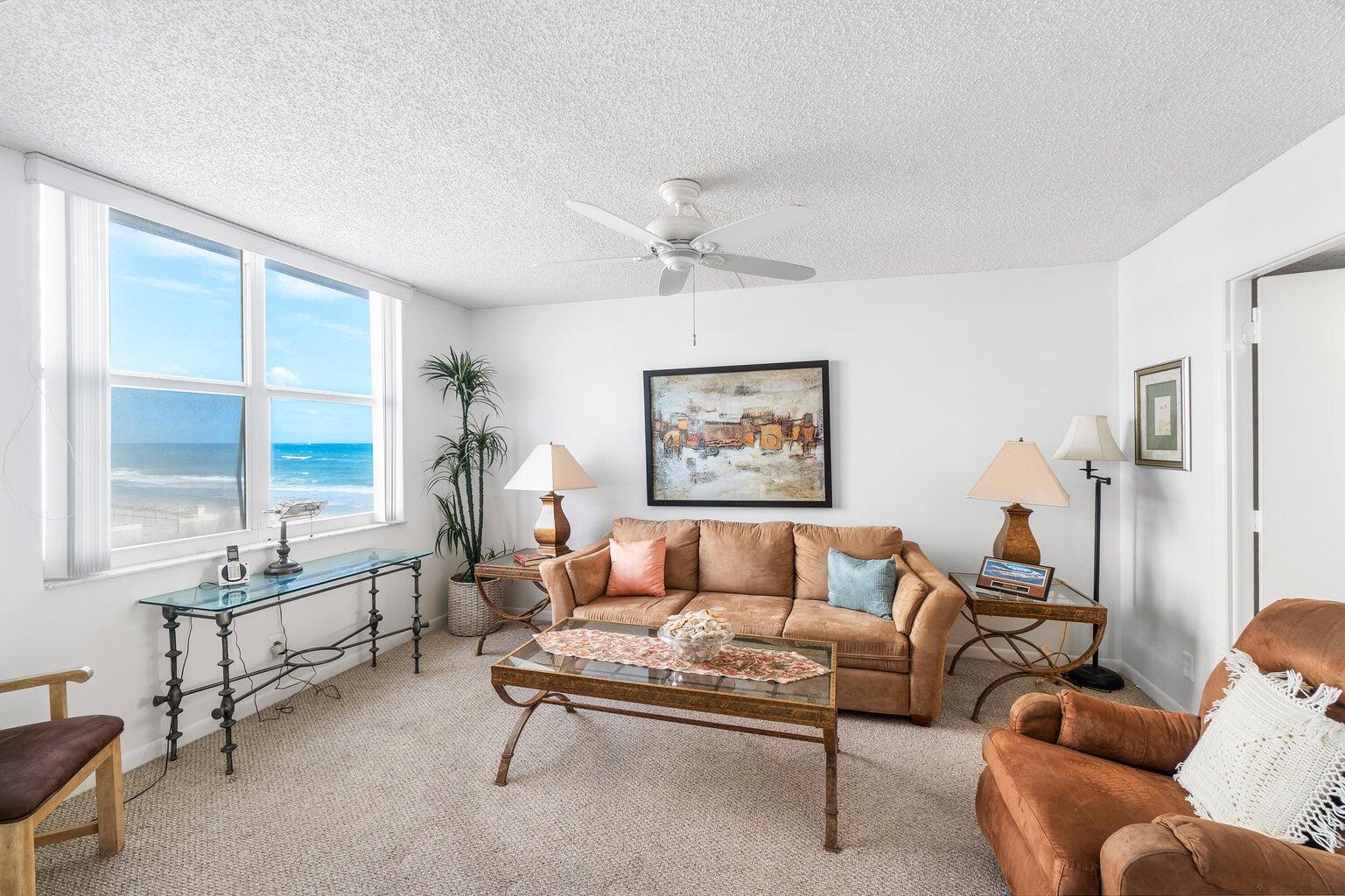 4511 South Ocean Boulevard, Unit 206 Highland Beach, FL 33487 - Photo 1 of 21 a living room with furniture and a large window