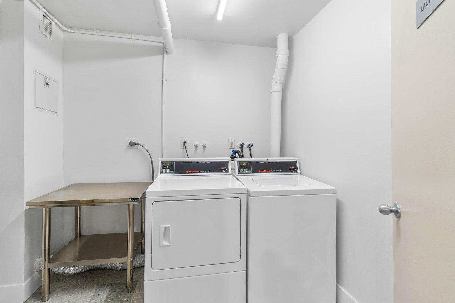 4511 South Ocean Boulevard, Unit 206 Highland Beach, FL 33487 - Photo 4 of 21 a utility room with dryer and washer