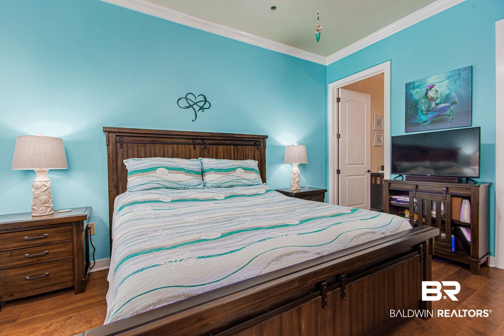 1430 Regency Road, Unit I201 Gulf Shores, AL 36542 - Photo 14 of 34 Bedroom featuring dark hardwood / wood-style floors and ornamental molding