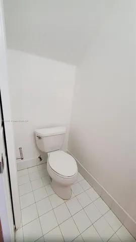 a kitchen with granite countertop a sink and a stove