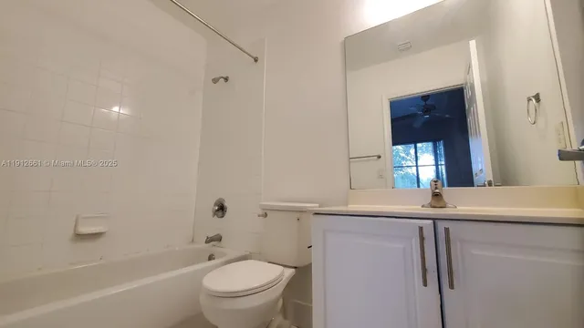 a bathroom with a sink a toilet and a bathtub
