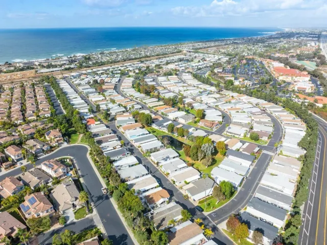 an aerial view of residential houses with outdoor space
