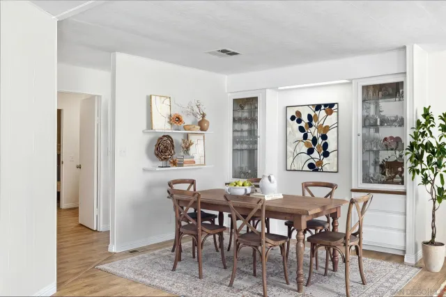 a dining room with furniture and window