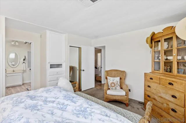 a bedroom with a bed and furniture