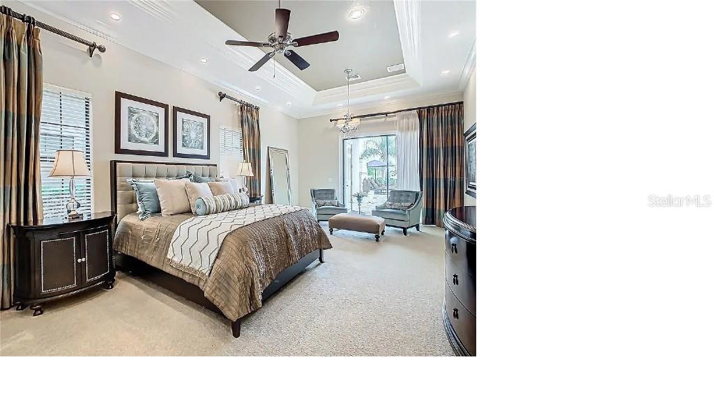 395 Muirfield Loop Reunion, FL 34747 - Photo 34 of 50 a living room with a bed furniture and a window