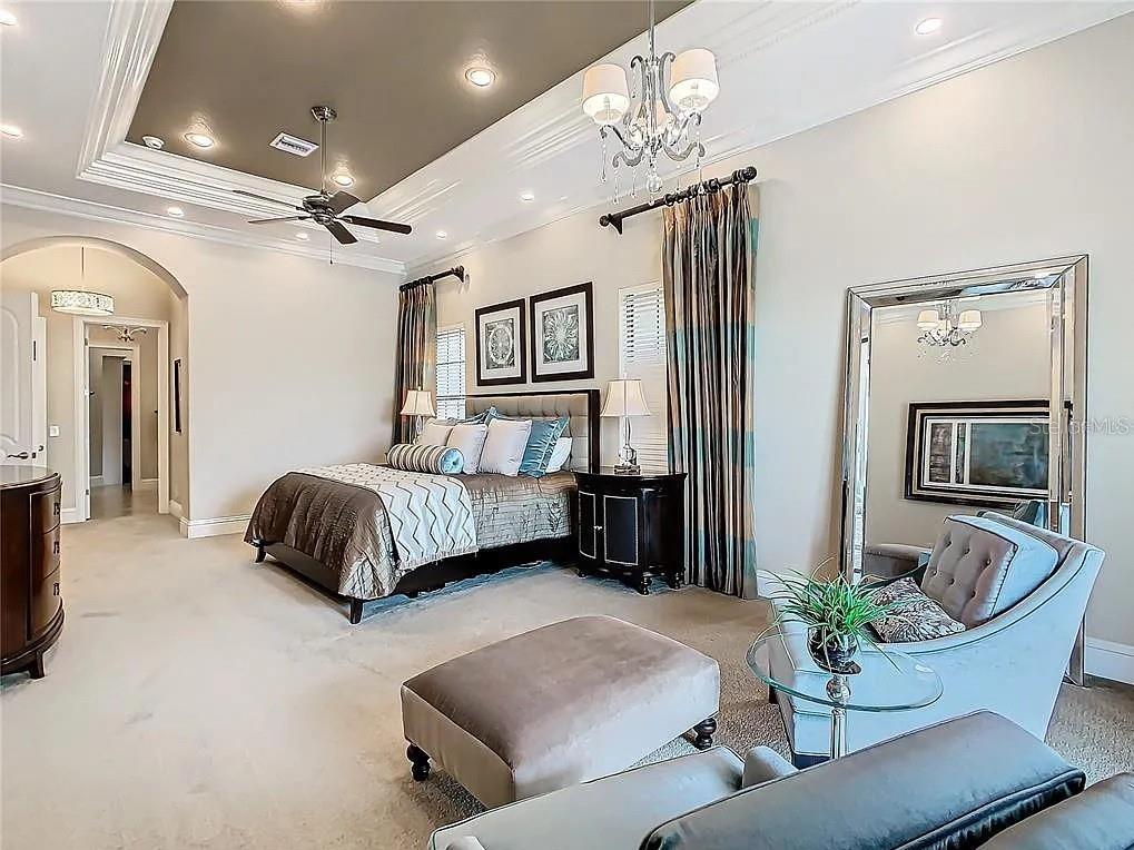 395 Muirfield Loop Reunion, FL 34747 - Photo 35 of 50 a bedroom with a bed patio couch and window