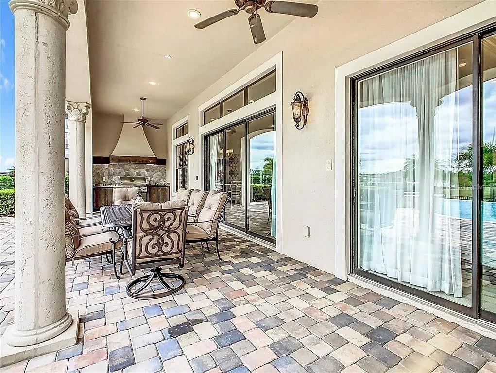 395 Muirfield Loop Reunion, FL 34747 - Photo 45 of 50 a dining room with furniture water view and wooden floor