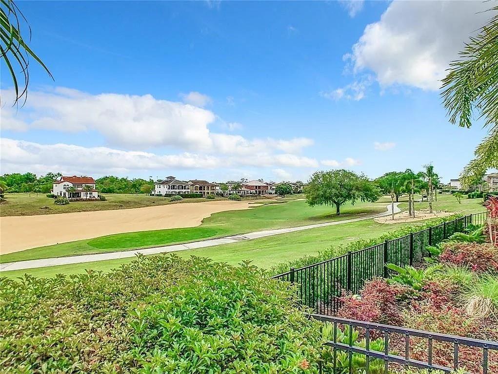 395 Muirfield Loop Reunion, FL 34747 - Photo 48 of 50 a view of a lake with a big yard